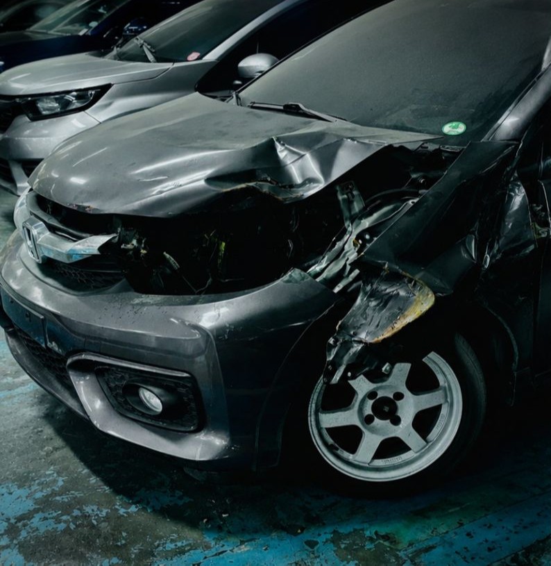 Before Honda body and paint repair — showing damage